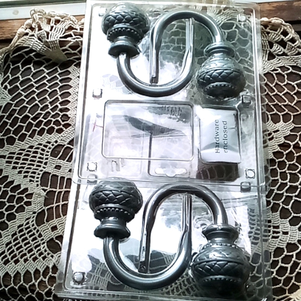 2 sets of gray metal curtain pull backs